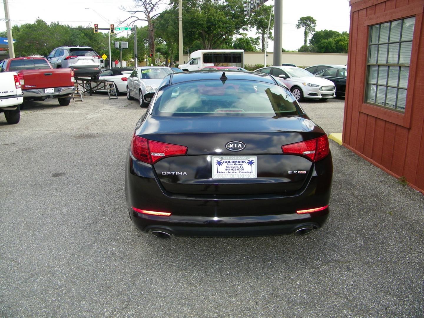 2012 Maroon /Black Kia Optima EX (5XXGN4A77CG) with an 2.4L L4 DOHC 16V engine, 6-Speed Automatic transmission, located at 4000 Bee Ridge Road, Sarasota, FL, 34233, (941) 926-0300, 27.298664, -82.489151 - Photo#4